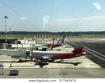 July 2019 Milan, Italy: Airplanes In Airport. Airport Runway