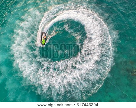 People Are Playing A Jet Ski In The Sea.aerial View. Top View.amazing Nature Background.the Color Of