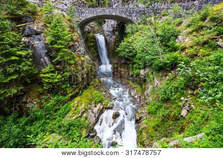 Bridge over a waterfall at Mount Rainier National Park, Washington, USA