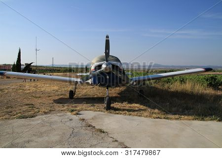 Ontur, Murcia, Spain- June 22, 2019: White And Blue Aircraft Parked In Aerodrome In A Sunny Day Of S