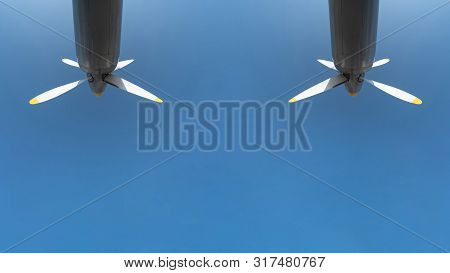 Two Airplane Propeller Of Military Aircraft, Copy Space. Blue Sky Background.