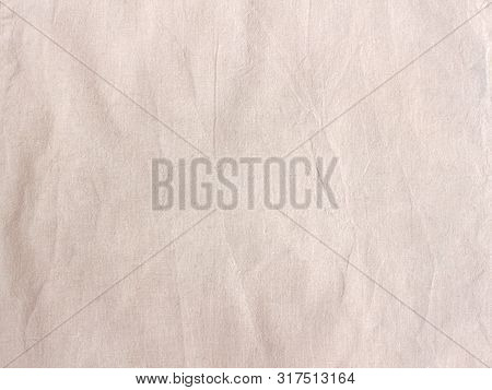 Linnen Crumpled Fabric Backgroung Texture. Natural Organic Rustic Woven Pattern. Light Beige Cut Fab