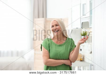 Portrait Of Happy Mature Woman At Home