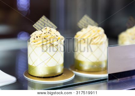 Close Up. Two Delicious Vanilla Cake With Fresh Berries, In Counter Bakery Shop, Sweet Pastry For De