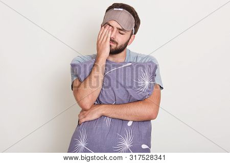 Indoor Shot Of Young Attractive Man Waking In Morning, Wants To Sleep, Handsome Guy Stretching And Y