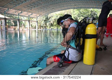 A Group Of People Doing Diving Training In A Swimming Pool In Batang / Central Java, Indonesia, Augu