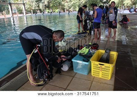 A Group Of People Doing Diving Training In A Swimming Pool In Batang / Central Java, Indonesia, Augu