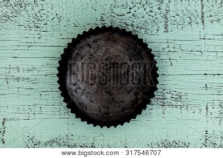 Old Vintage Baking Pan And Tins On Wooden Background. Selective Focus.