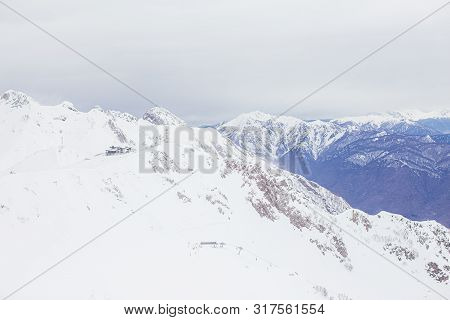 Winter Panorama View Of Mountains. Cold Winter Maille Cloudy Day In Mountains