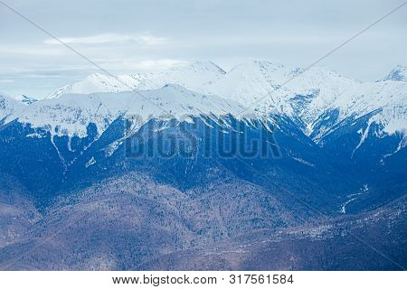 Winter Panorama View Of Mountains. Cold Winter Maille Cloudy Day In Mountains
