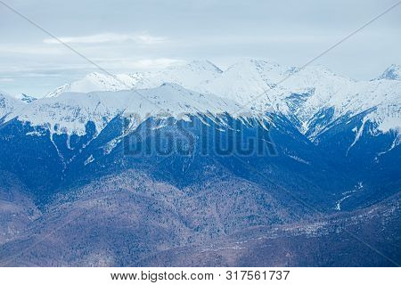 Winter Panorama View Of Mountains. Cold Winter Maille Cloudy Day In Mountains