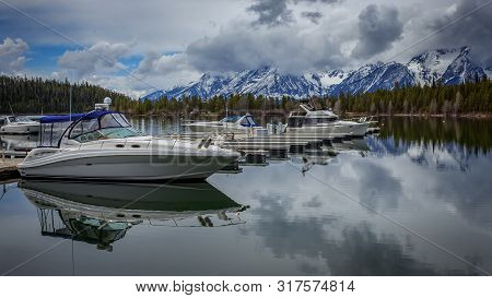 Colter Bay, Wyoming / Usa - 05-15-2015 : Boats Rest In The Docks Of Colter Bay Marina, Jackson Lake,