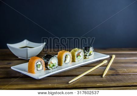 Different Rolls On A White Rectangular Plate