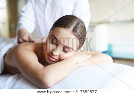 Portrait Of Beautiful Woman Enjoying Massage In Spa, Copy Space