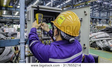 Blur Background Of Electrical Engineer Are Working On Factory Site, Technician Check Fault In Power 