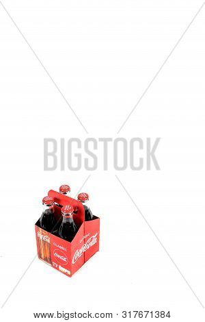 London, United Kingdom, 16th August 2019:- A Pack Of 4 Coca-cola Glass Bottles. Contains 10.6g Of Su
