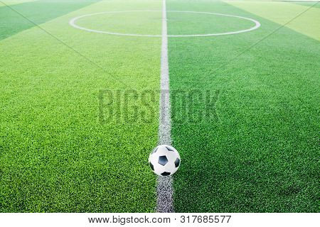 Soccer Ball On Artificial Turf For Green Background.