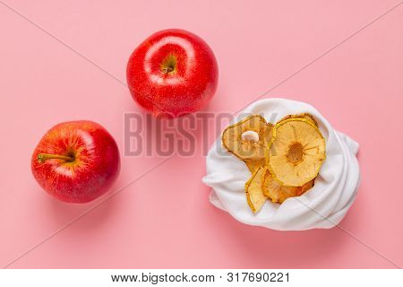 Homemade Sun-dried Organic Apple Slices, Crispy Apple Chips, On Pink Background With Fresh Apple.