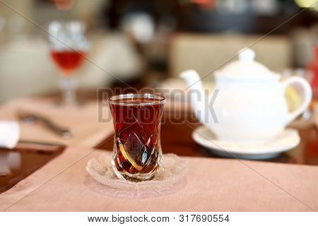 Armud Glass With Black Tea In Cafe