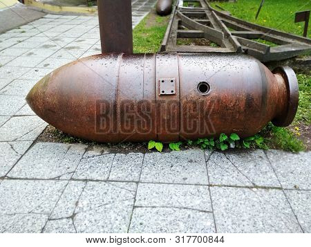 A Huge Bomb Rusty Color Of In Horizontal Position Large Plan.