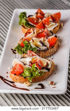 Bruschetta With Tomatoes, Lettuce, Camambert, Balsamic Vinegar