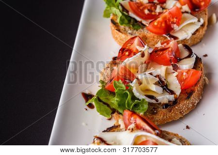 Bruschetta With Tomatoes, Lettuce, Camambert, Balsamic Vinegar