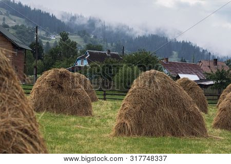 Stacks With Karpatian Hills At Background