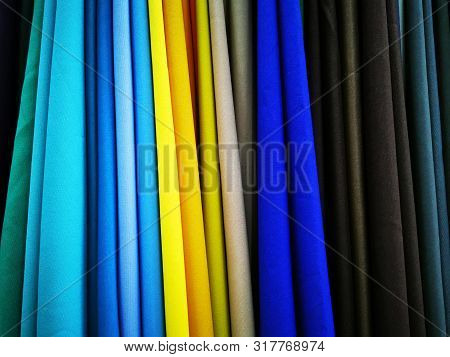 Multicolored Gabardine Fabric. Folded Into Thin Strips Of Textile Pieces For Display In The Store. C