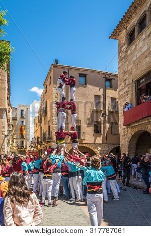 Montblanc,spain - May 19,2019 - Building Human Towers In The Streets Of Montblanc. The Area Around M