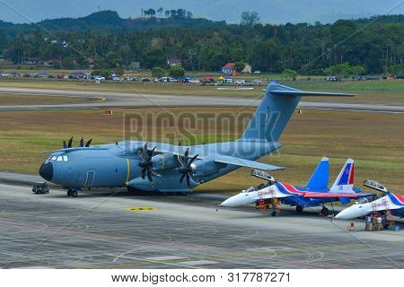 Langkawi, Malaysia - Mar 29, 2019. Rmaf Airbus A400m Atlas And Su-30sm Russian Knights Docking At La