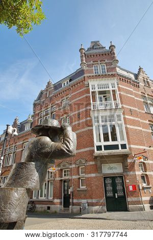 Maastricht, Netherlands - August 04, 2019: Statue Of De Wiekeneer (the Wick Down) Located In Wyck Ne