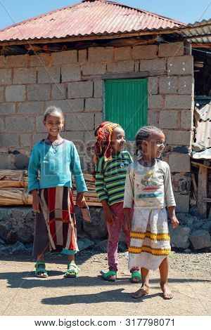 Debre Libanos, Ethiopia - April 19, 2019: Group Of Children On The Street Behind Famous Monastery De