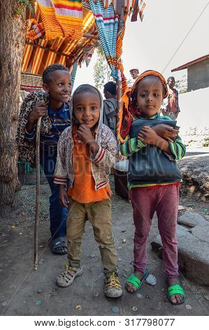 Debre Libanos, Ethiopia - April 19, 2019: Group Of Children On The Street Behind Famous Monastery De