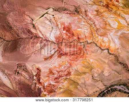 A Stunning Panorama Of A Mountain Chain Of Peaks, A Canyon With Red Clay, Top View. Mars Fields In A
