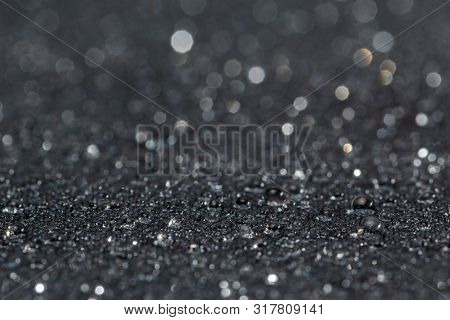 Dark Gray Waterproof Hydrophobic Flat Cloth Closeup With Rain Drops Selective Focus Background