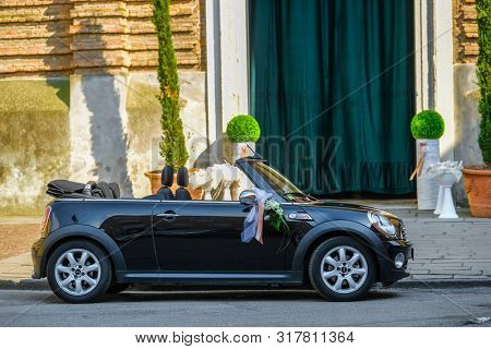 Rovigo, Italy - July, 7, 2019: wedding car parked infront of a church in Rovigo, Italy