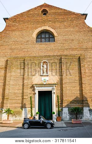 Rovigo, Italy - July, 7, 2019: wedding car parked infront of a church in Rovigo, Italy