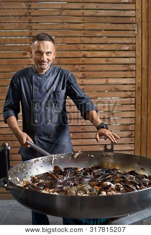 Preparetion Dish Of Spaghetti With Clams In A Restaurant Kitchen