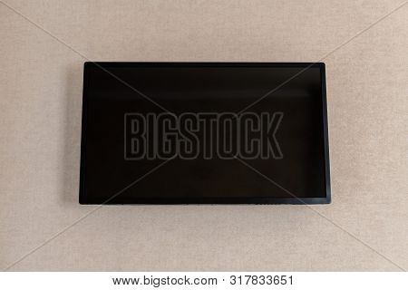Led Tv Black Screen On Wall In Hotel. Big Flat Screen. Power Is Turned Off .