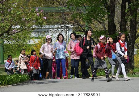 Pyongyang, North Korea - May 1, 2019: People Walking In The Taesongsan Funfair. Is An Amusement Park