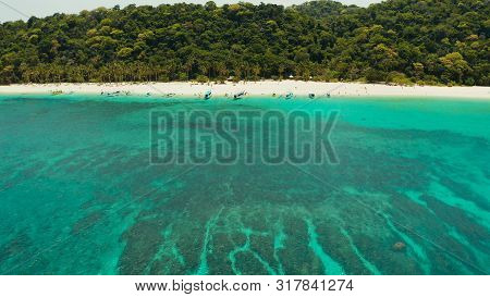 Tropical Landscape: Sandy Beach With Palm Trees And Turquoise Waters Of The Coral Reef Top View, Puk