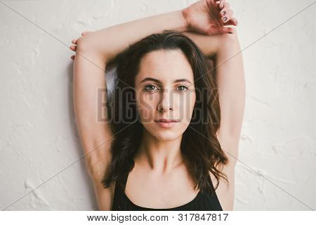 Portrait Of Young Sports Woman Of Athletic Build In Swimsuit. Woman Spend Time In A Dance Studio. Be
