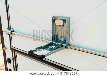 Photograph Of A Metal Lock On A White Door