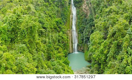 Mantayupan Falls In The Jungle, Island Of Cebu, Philippines. Waterfall In The Green Forest.