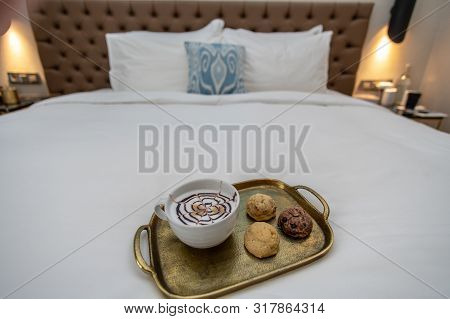 Cappuccino With Baked Goods On Tray