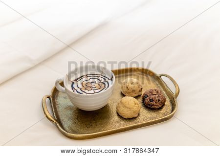 Cappuccino With Baked Goods On Tray