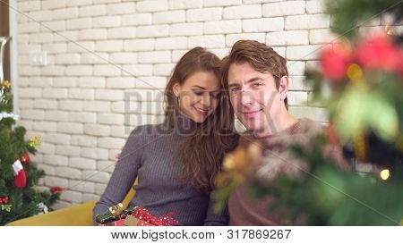 Caucasian Couple Celebrate Early Christmas Morning Light