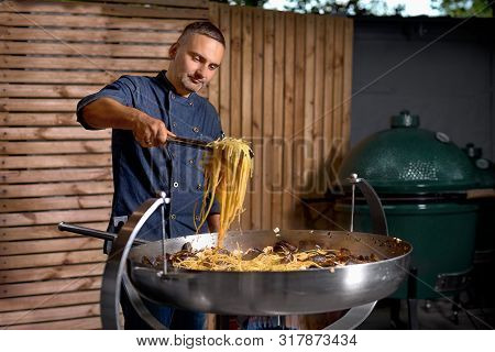 Preparetion Dish Of Spaghetti With Clams In A Restaurant Kitchen