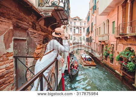 Woman Looking At Canal With Gandola Summer Vacation