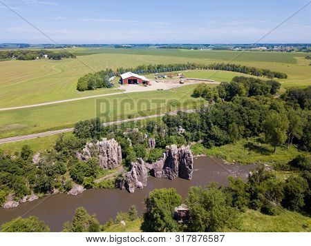 Aerial view of farmland, river, and cliffs in eastern South Dakota, USA.